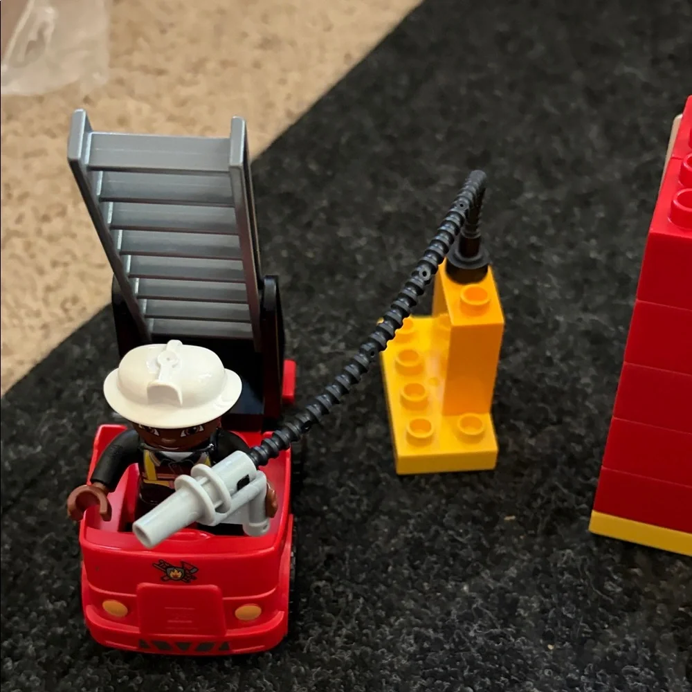 Lego Duplo Fire Truck With Firefighter Figure with fire hydrant and flame pieces